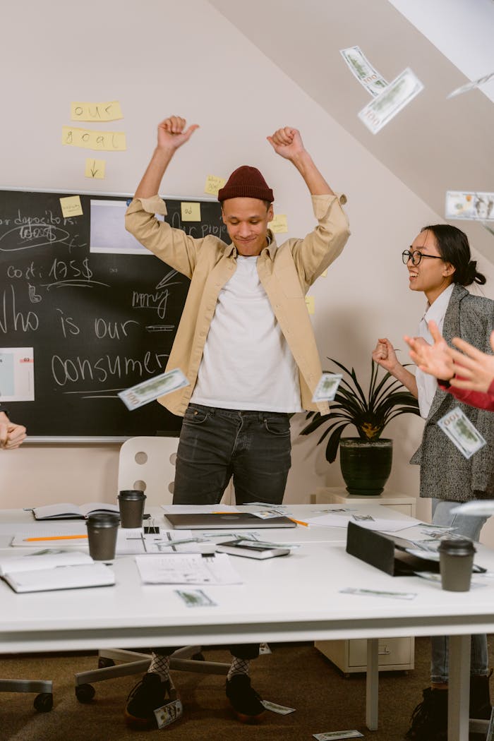 A lively office scene with diverse team members celebrating and brainstorming ideas.
